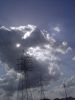 Electric tower and sunny skies. Tras Nubes.