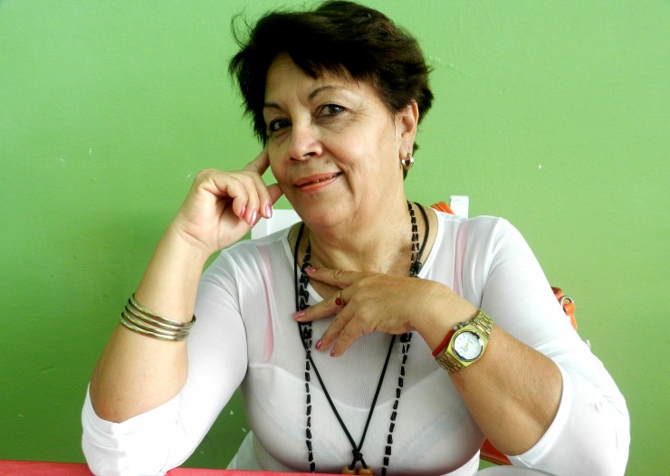 Foto 1/La mujer cubana: ngel protector, flor y sostn